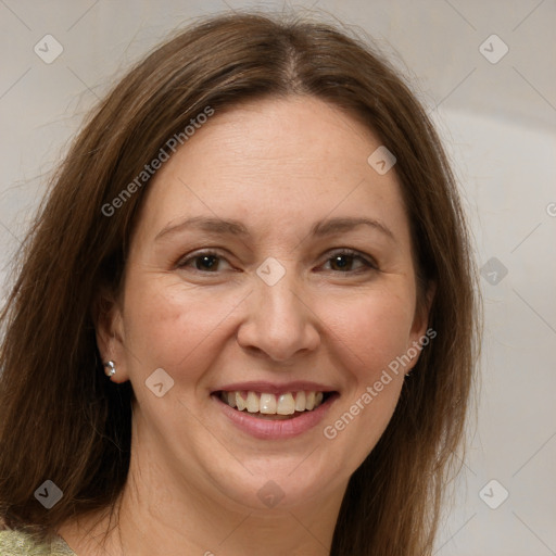 Joyful white adult female with long  brown hair and grey eyes