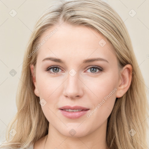 Joyful white young-adult female with long  brown hair and blue eyes