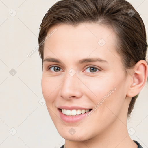 Joyful white young-adult female with medium  brown hair and grey eyes