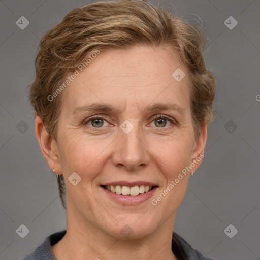 Joyful white adult female with short  brown hair and grey eyes