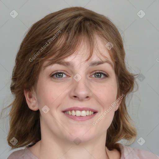 Joyful white young-adult female with medium  brown hair and blue eyes