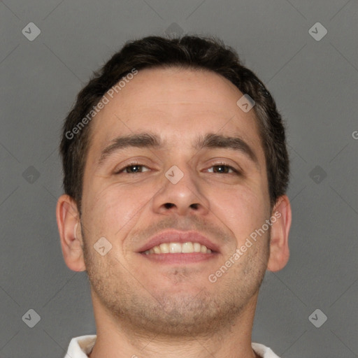 Joyful white adult male with short  brown hair and brown eyes