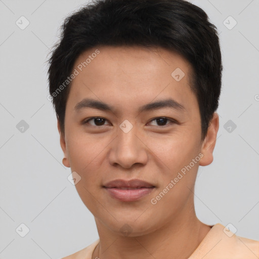 Joyful asian young-adult male with short  black hair and brown eyes