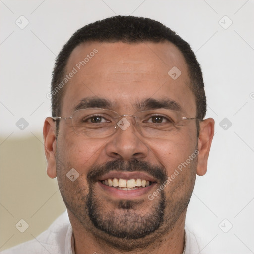 Joyful white adult male with short  black hair and brown eyes