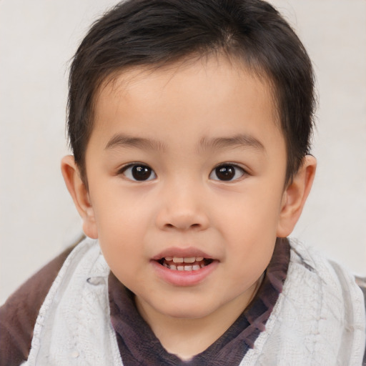 Joyful white child male with short  brown hair and brown eyes