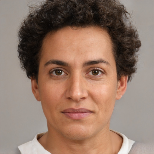 Joyful white adult female with short  brown hair and brown eyes