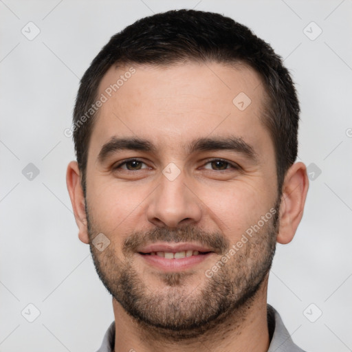 Joyful white young-adult male with short  brown hair and brown eyes