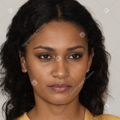 Joyful black young-adult female with long  brown hair and brown eyes