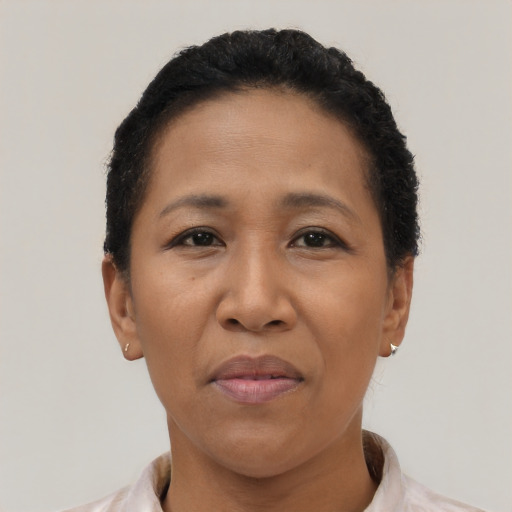 Joyful latino adult female with short  black hair and brown eyes