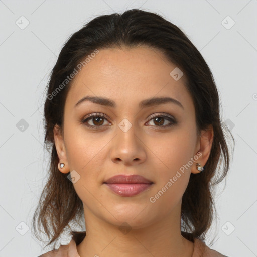 Joyful latino young-adult female with medium  brown hair and brown eyes