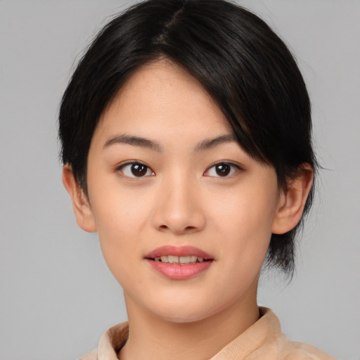 Joyful asian young-adult female with medium  black hair and brown eyes
