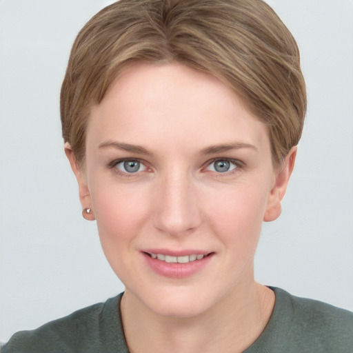 Joyful white young-adult female with short  brown hair and grey eyes