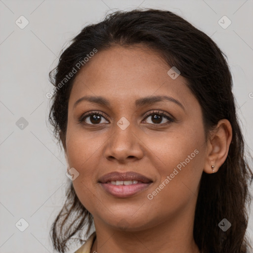 Joyful latino young-adult female with long  brown hair and brown eyes