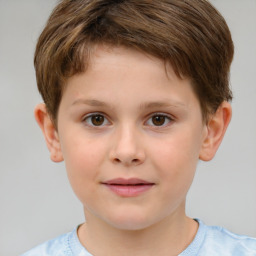 Joyful white child male with short  brown hair and brown eyes