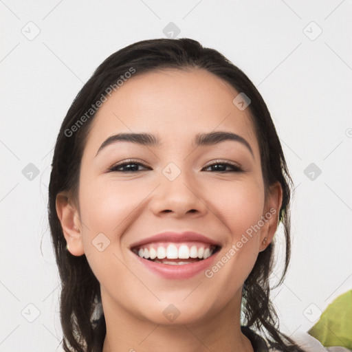 Joyful white young-adult female with long  black hair and brown eyes