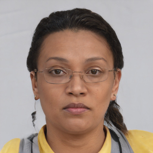 Neutral latino adult female with short  brown hair and brown eyes