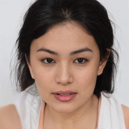 Joyful asian young-adult female with medium  brown hair and brown eyes