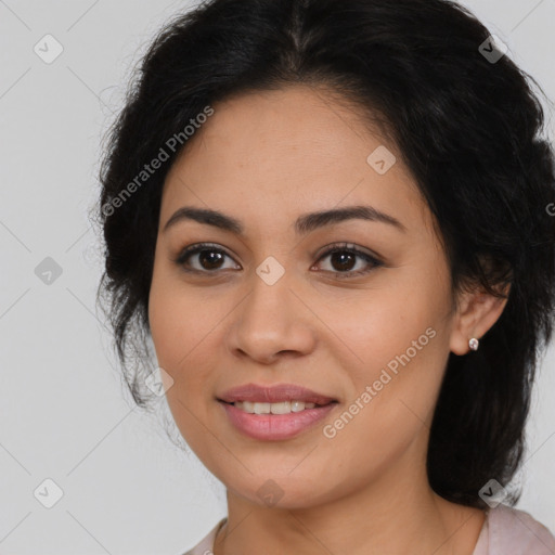 Joyful latino young-adult female with medium  brown hair and brown eyes