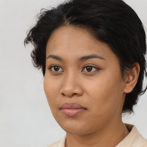 Neutral latino young-adult female with medium  brown hair and brown eyes