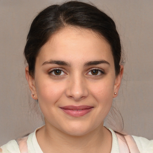 Joyful white young-adult female with medium  brown hair and brown eyes