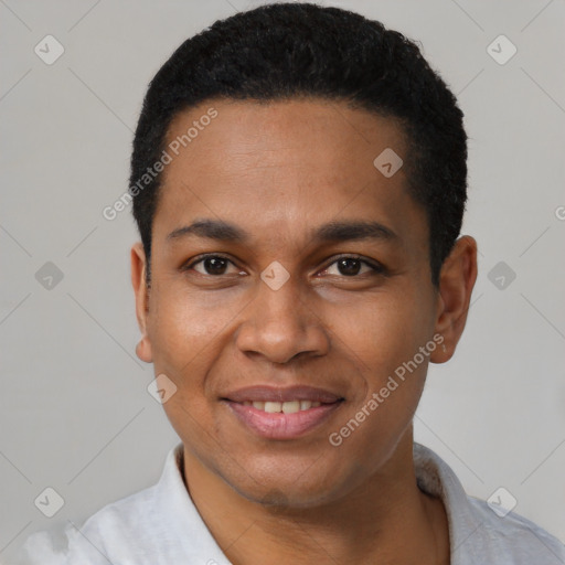 Joyful latino young-adult male with short  black hair and brown eyes