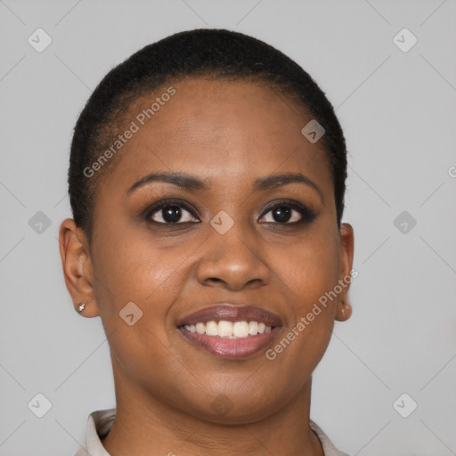 Joyful black young-adult female with short  brown hair and brown eyes