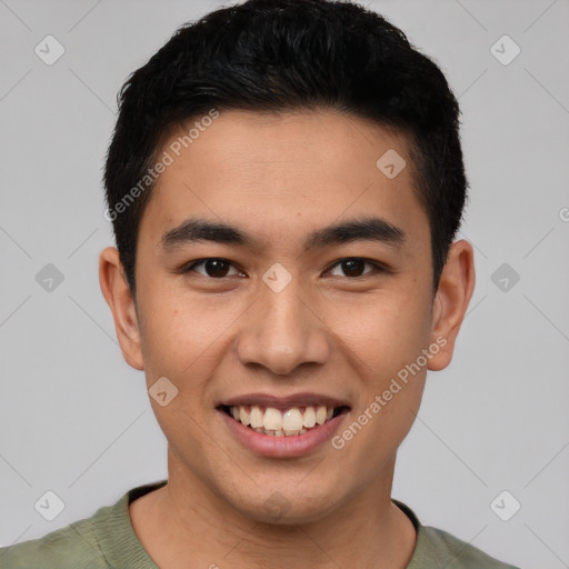 Joyful latino young-adult male with short  brown hair and brown eyes