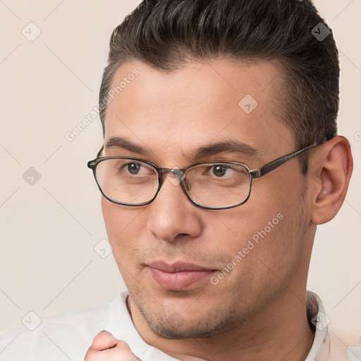 Joyful white young-adult male with short  brown hair and brown eyes