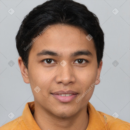 Joyful latino young-adult male with short  brown hair and brown eyes