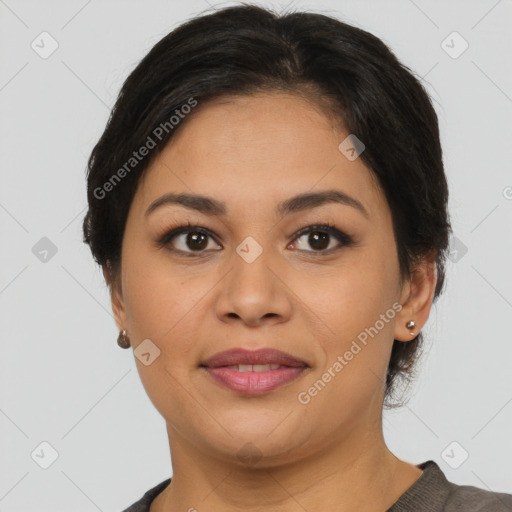 Joyful latino young-adult female with short  brown hair and brown eyes