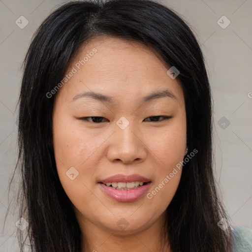 Joyful asian young-adult female with long  brown hair and brown eyes