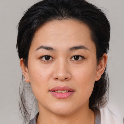Joyful white young-adult female with medium  brown hair and brown eyes