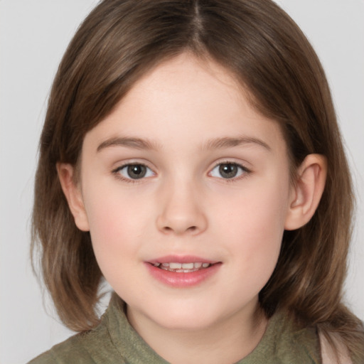 Joyful white child female with medium  brown hair and brown eyes