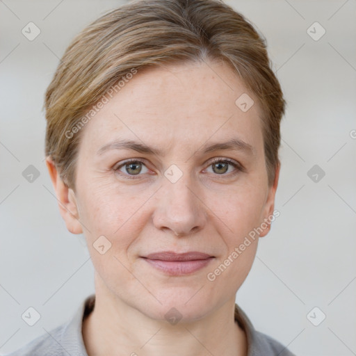 Joyful white adult female with short  brown hair and grey eyes