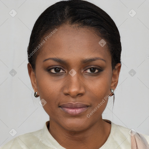 Joyful black young-adult female with short  brown hair and brown eyes