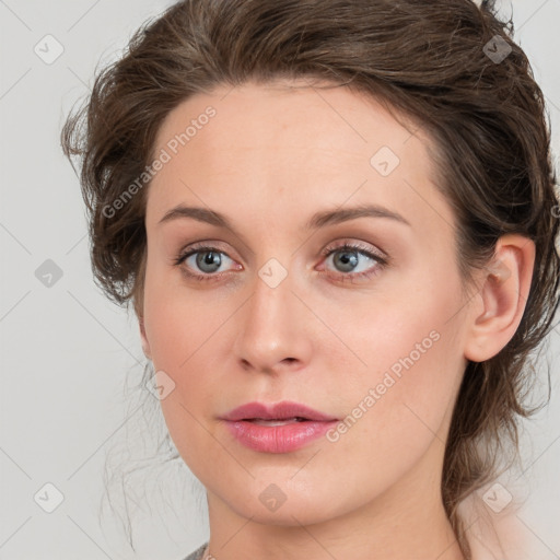 Joyful white young-adult female with medium  brown hair and blue eyes