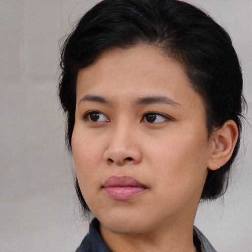 Neutral asian young-adult female with medium  black hair and brown eyes