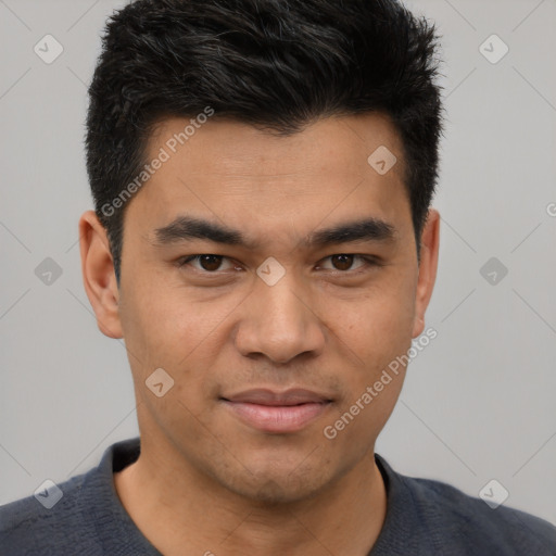 Joyful asian young-adult male with short  brown hair and brown eyes