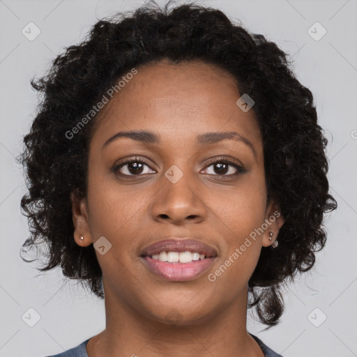 Joyful black young-adult female with long  brown hair and brown eyes