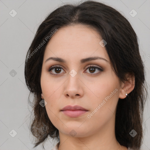 Neutral white young-adult female with long  brown hair and brown eyes