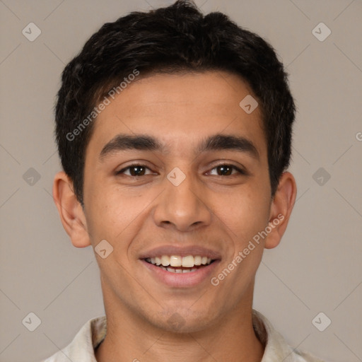 Joyful latino young-adult male with short  brown hair and brown eyes