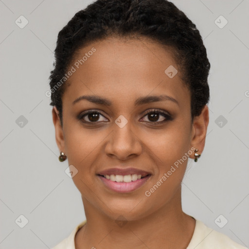 Joyful latino young-adult female with short  black hair and brown eyes