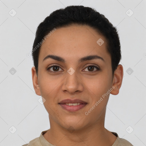 Joyful latino young-adult female with short  black hair and brown eyes