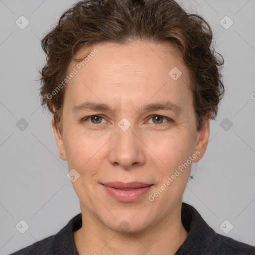 Joyful white adult female with short  brown hair and grey eyes