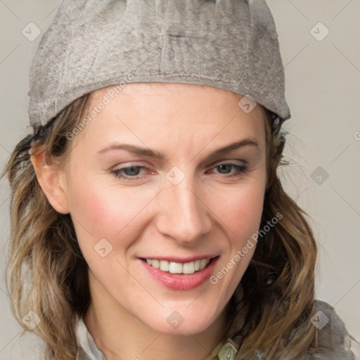 Joyful white young-adult female with medium  brown hair and blue eyes