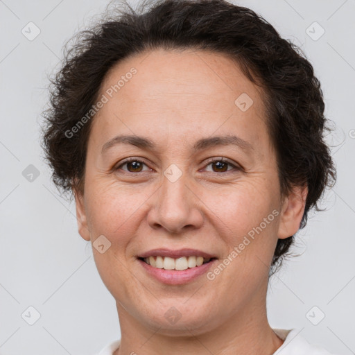 Joyful white adult female with short  brown hair and brown eyes