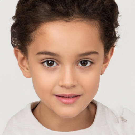 Joyful white child female with short  brown hair and brown eyes