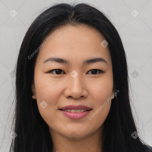 Joyful asian young-adult female with long  brown hair and brown eyes