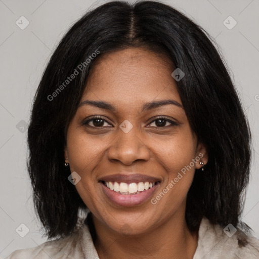 Joyful black young-adult female with medium  brown hair and brown eyes