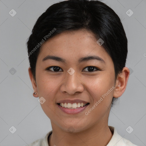 Joyful asian young-adult female with short  brown hair and brown eyes